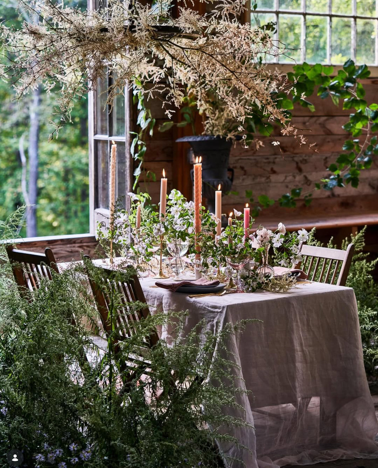 Ariella Chezar and Anne Long Floral Retreat at The Dahlia House in Skagit Valley WA. Elegant outdoor dining table setting with candles and greenery